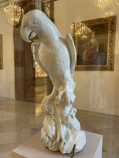 a porcelain parrot figurine